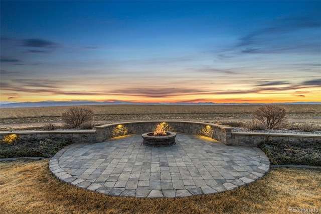 3947 Taliesin Way, Fort Collins, CO 80524 - patio terrace at dusk with a mountain view and an outdoor fire pit