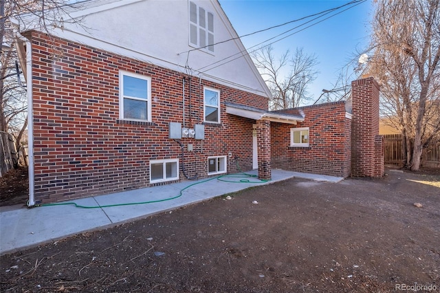 back of property with a patio