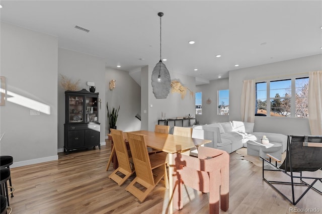 dining area with visible vents, recessed lighting, light wood-type flooring, and baseboards