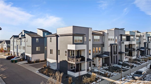 exterior space with a residential view and an attached garage