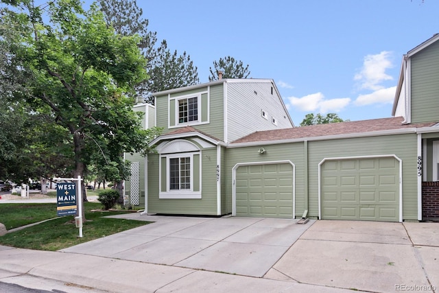 8997 W 88th Ave, Westminster, CO 80021 - view of front of house featuring concrete driveway and a garage
