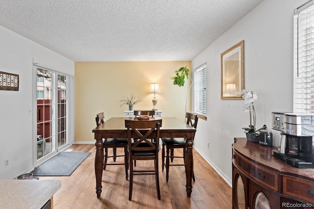 8997 W 88th Ave, Westminster, CO 80021 - dining room with a textured ceiling and light wood-type flooring