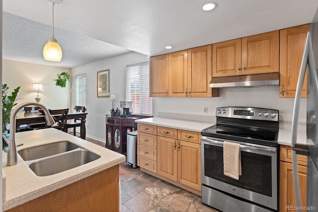 8997 W 88th Ave, Westminster, CO 80021 - kitchen featuring stainless steel appliances, under cabinet range hood, light countertops, a textured ceiling, and hanging light fixtures
