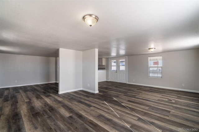 530 Illinois St, Penrose, CO 81240 - unfurnished living room featuring dark wood-type flooring