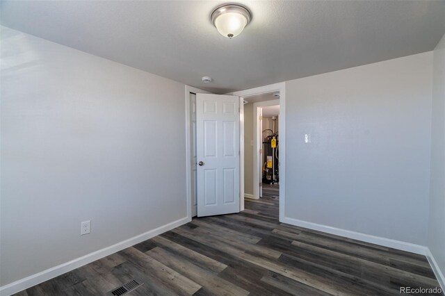 530 Illinois St, Penrose, CO 81240 - empty room with dark hardwood / wood-style floors