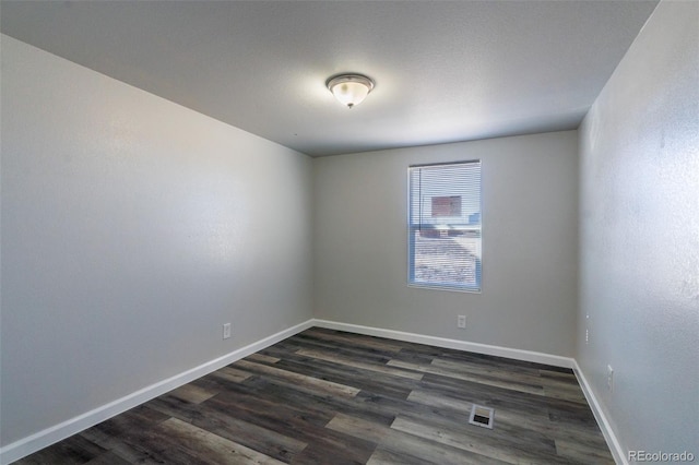 530 Illinois St, Penrose, CO 81240 - empty room with dark hardwood / wood-style flooring