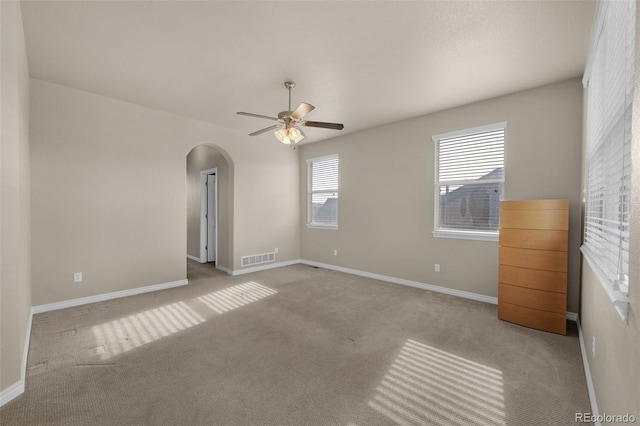 1053 Crystal Basin Dr, Colorado Springs, CO 80921 - spare room with arched walkways, a ceiling fan, and carpet floors