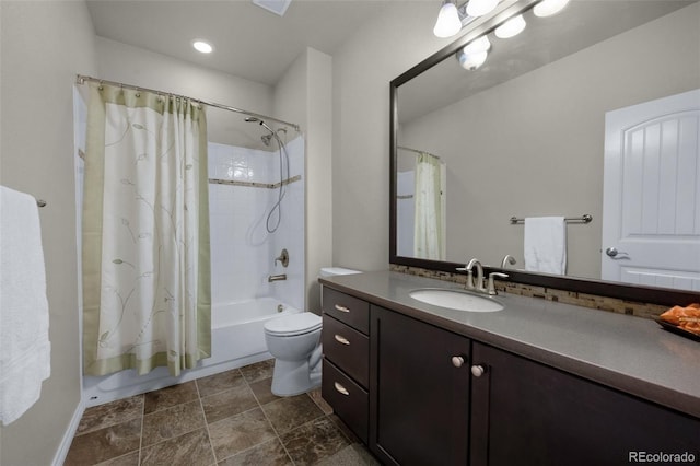 full bathroom featuring vanity, toilet, and shower / bath combo with shower curtain