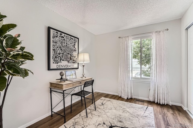 8993 W 88th Pl, Westminster, CO 80021 - home office featuring a textured ceiling and wood finished floors