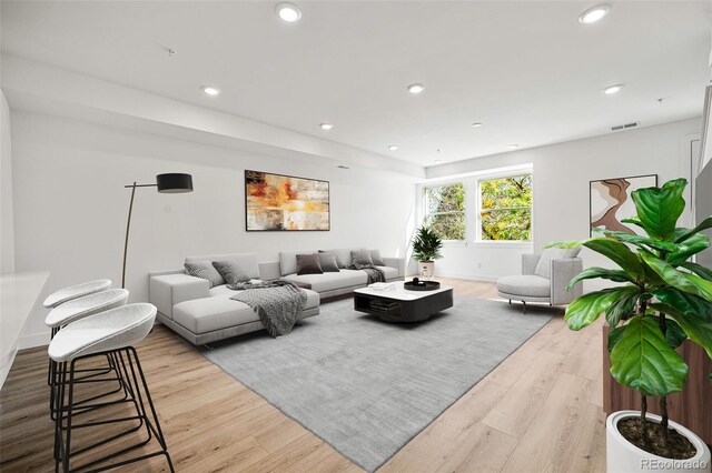 living room with light hardwood / wood-style flooring