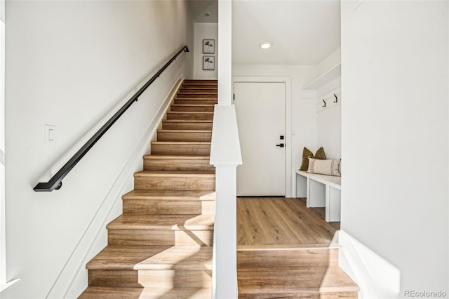 staircase featuring wood finished floors