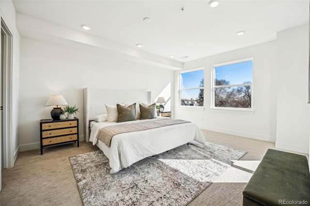 bedroom with baseboards, recessed lighting, visible vents, and light colored carpet