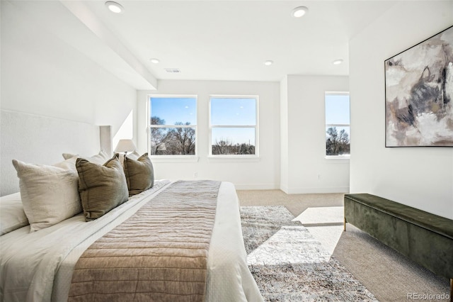 bedroom featuring recessed lighting, baseboards, visible vents, and light colored carpet