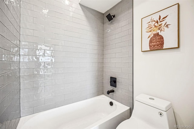 bathroom with bathing tub / shower combination and toilet