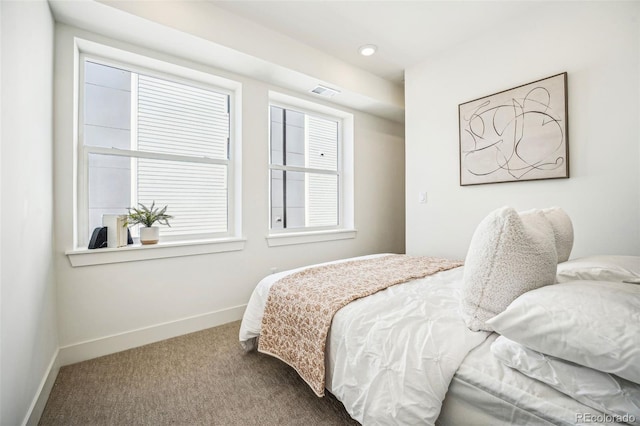 bedroom featuring carpet floors, recessed lighting, visible vents, and baseboards