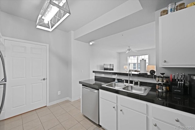 kitchen with white cabinetry, sink, light tile patterned floors, and dishwasher