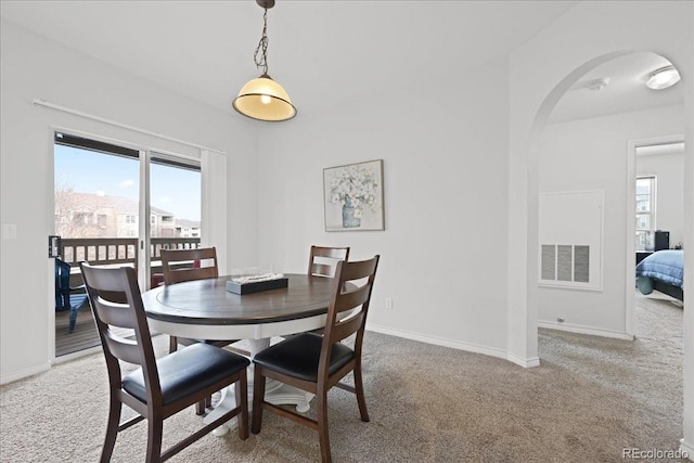 dining area featuring carpet