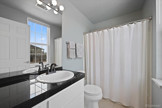 bathroom with walk in shower, tile patterned floors, toilet, and vanity