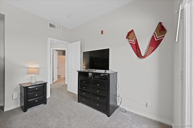 bedroom with light colored carpet