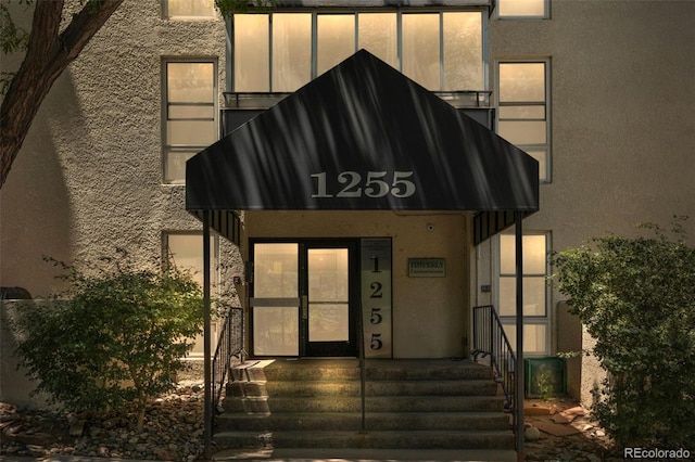 1255 N Ogden St Unit 406, Denver, CO 80218 - view of exterior entry featuring stucco siding