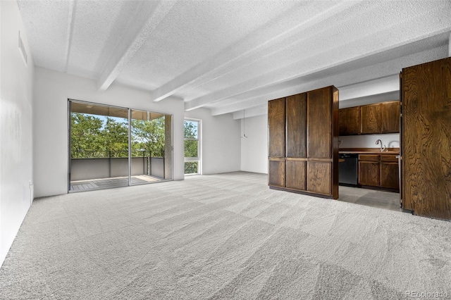 1255 N Ogden St Unit 406, Denver, CO 80218 - unfurnished living room featuring beamed ceiling, light carpet, and a textured ceiling
