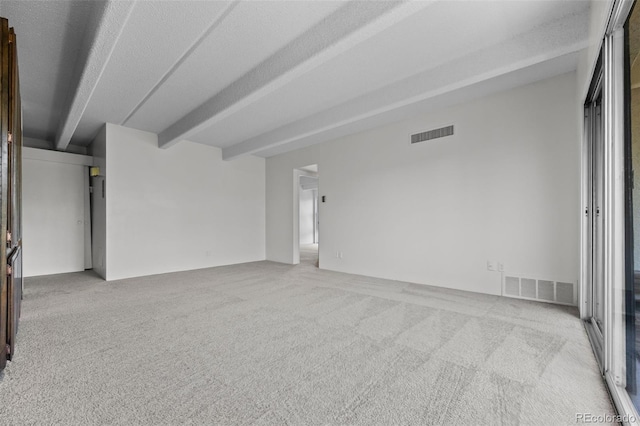 1255 N Ogden St Unit 406, Denver, CO 80218 - carpeted spare room with beamed ceiling