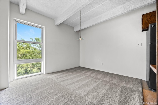 1255 N Ogden St Unit 406, Denver, CO 80218 - empty room with a textured ceiling, beam ceiling, and carpet flooring