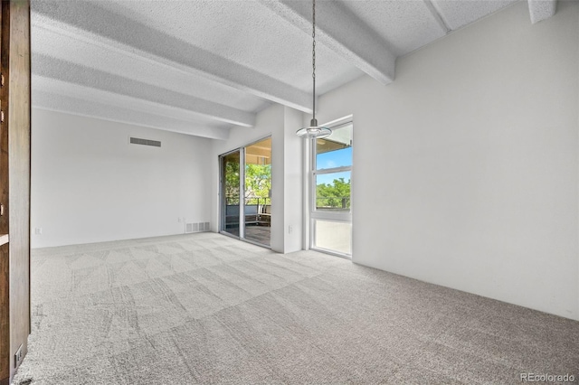 1255 N Ogden St Unit 406, Denver, CO 80218 - carpeted empty room featuring beamed ceiling and a textured ceiling