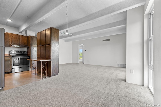 1255 N Ogden St Unit 406, Denver, CO 80218 - kitchen featuring stainless steel electric range oven, under cabinet range hood, beam ceiling, open floor plan, and light carpet