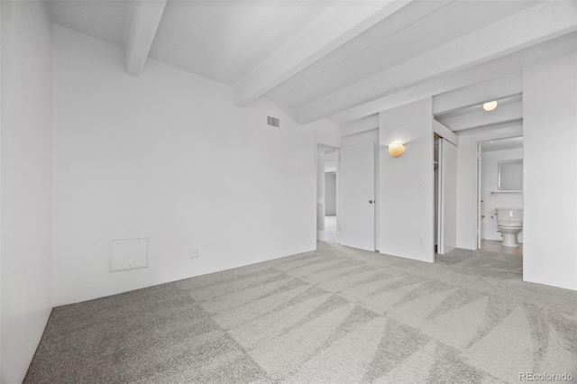 1255 N Ogden St Unit 406, Denver, CO 80218 - spare room with beamed ceiling and carpet