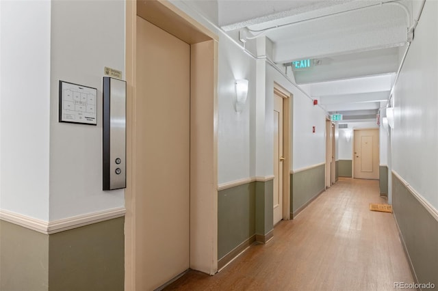 1255 N Ogden St Unit 406, Denver, CO 80218 - hallway featuring light wood-style flooring