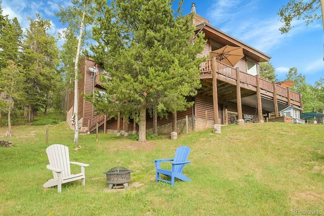 31112 Shadow Mountain Dr, Conifer, CO 80433 - rear view of house featuring an outdoor fire pit, a lawn, a wooden deck, and stairway