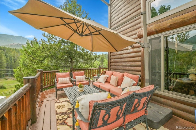 31112 Shadow Mountain Dr, Conifer, CO 80433 - wooden deck with an outdoor living space and a mountain view