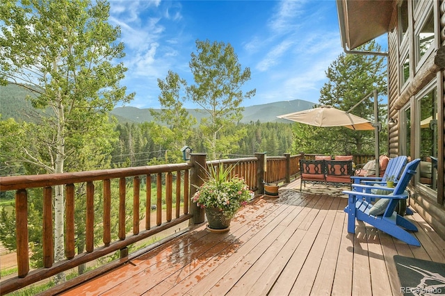 31112 Shadow Mountain Dr, Conifer, CO 80433 - deck featuring a mountain view and a view of trees