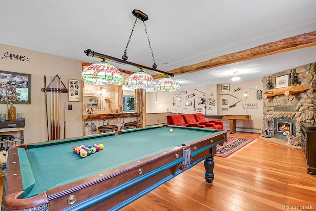 31112 Shadow Mountain Dr, Conifer, CO 80433 - rec room featuring pool table, wood finished floors, a baseboard radiator, and a stone fireplace