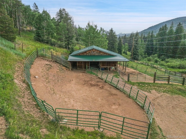 31112 Shadow Mountain Dr, Conifer, CO 80433 - view of home's community with an exterior structure, a rural view, an outbuilding, and a wooded view