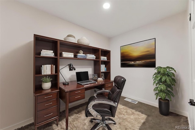 home office featuring baseboards, visible vents, and dark colored carpet