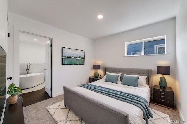 bedroom featuring baseboards, recessed lighting, and connected bathroom