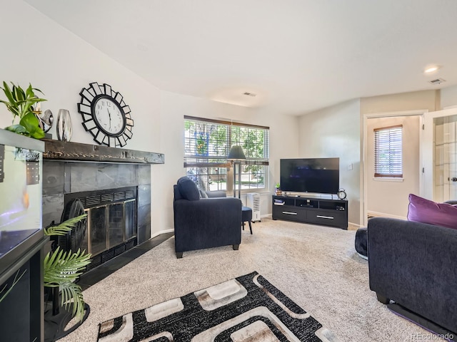 4121 W 111th Cir, Westminster, CO 80031 - carpeted living room with a tiled fireplace and healthy amount of natural light
