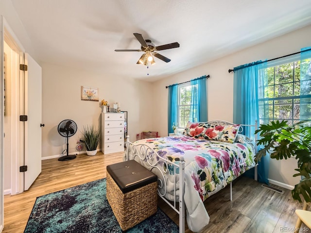 4121 W 111th Cir, Westminster, CO 80031 - bedroom with multiple windows, wood finished floors, and ceiling fan