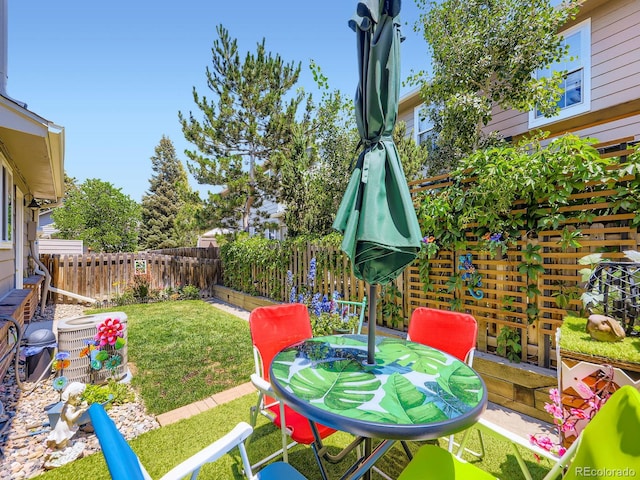 4121 W 111th Cir, Westminster, CO 80031 - fenced backyard featuring outdoor dining area