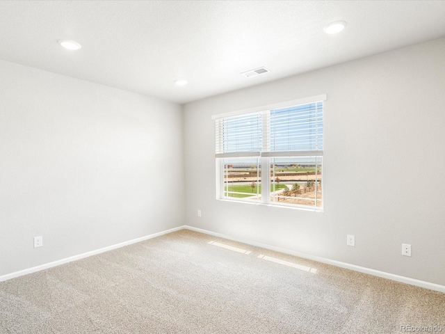 spare room with carpet floors