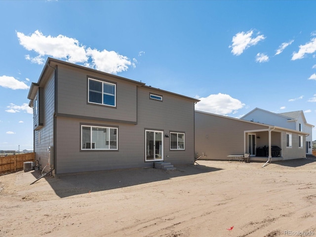 back of house with a patio area and central air condition unit