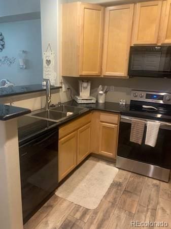 kitchen featuring electric range, dishwasher, wood tiled floor, black microwave, and a sink