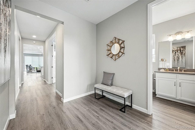 1592 Maggie Mae Ln, Castle Rock, CO 80104 - hallway with wood finished floors, baseboards, a sink, and recessed lighting