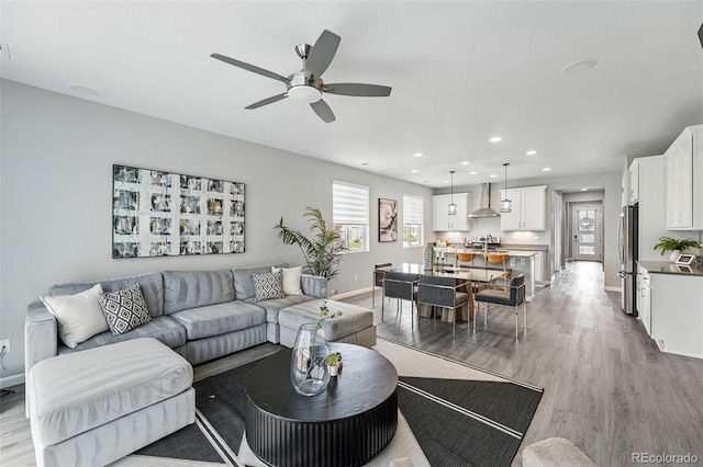 1592 Maggie Mae Ln, Castle Rock, CO 80104 - living room featuring ceiling fan, light wood-style floors, recessed lighting, and baseboards