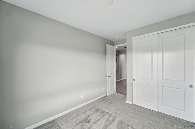 1592 Maggie Mae Ln, Castle Rock, CO 80104 - unfurnished bedroom featuring carpet floors, baseboards, and a closet