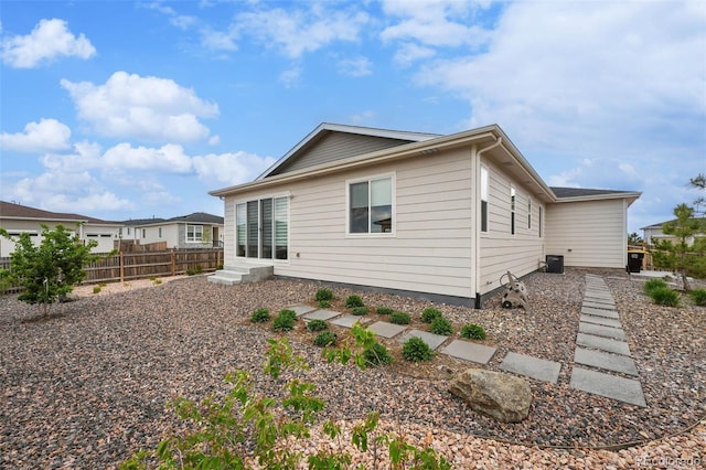 1592 Maggie Mae Ln, Castle Rock, CO 80104 - rear view of house featuring fence and central air condition unit
