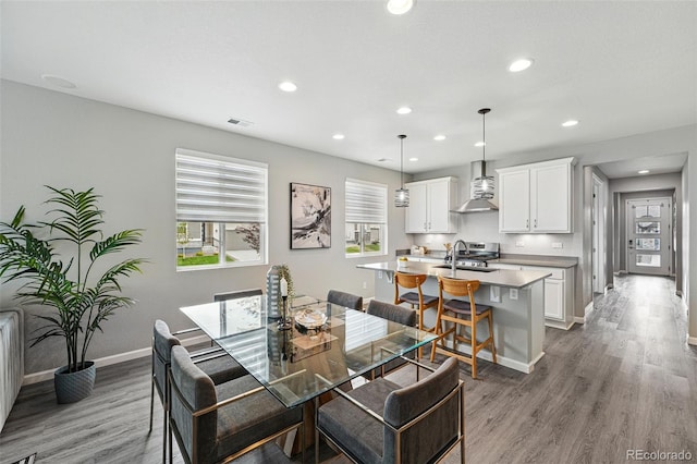 1592 Maggie Mae Ln, Castle Rock, CO 80104 - dining area featuring wood finished floors, baseboards, and recessed lighting
