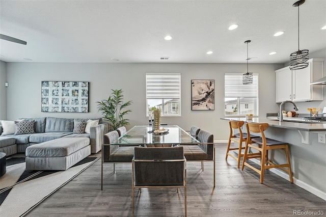 1592 Maggie Mae Ln, Castle Rock, CO 80104 - dining space with recessed lighting, dark wood finished floors, and baseboards
